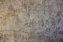Chinese graffiti carvings on an ancient tower wall