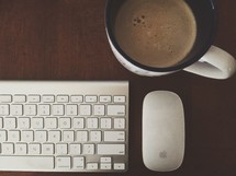 mouse, keyboard, and coffee mug