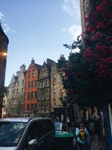 row houses and pedestrians on sidewalks in Scotland 