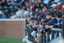 baseball players in a dugout 
