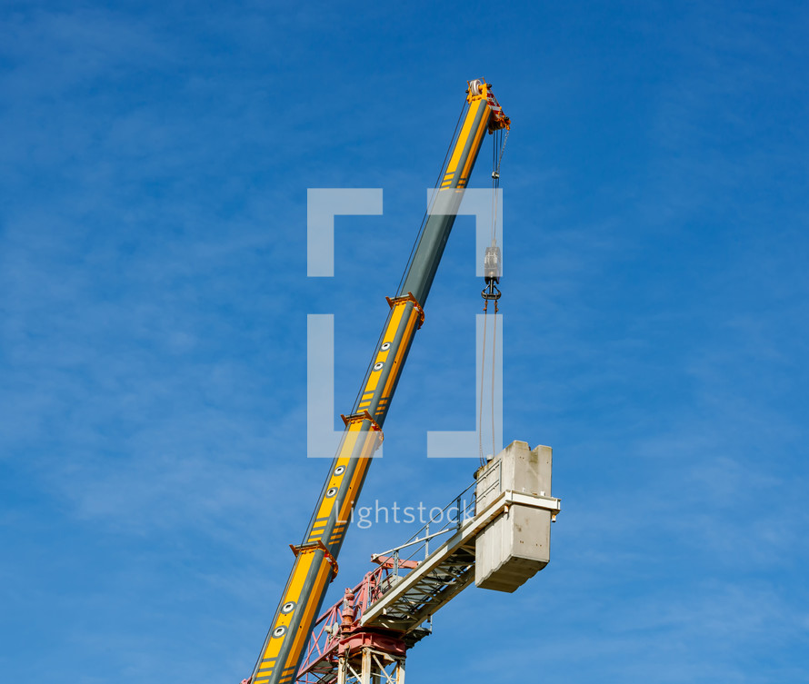 Crane disassembly, separation of components and removal of counterweights.