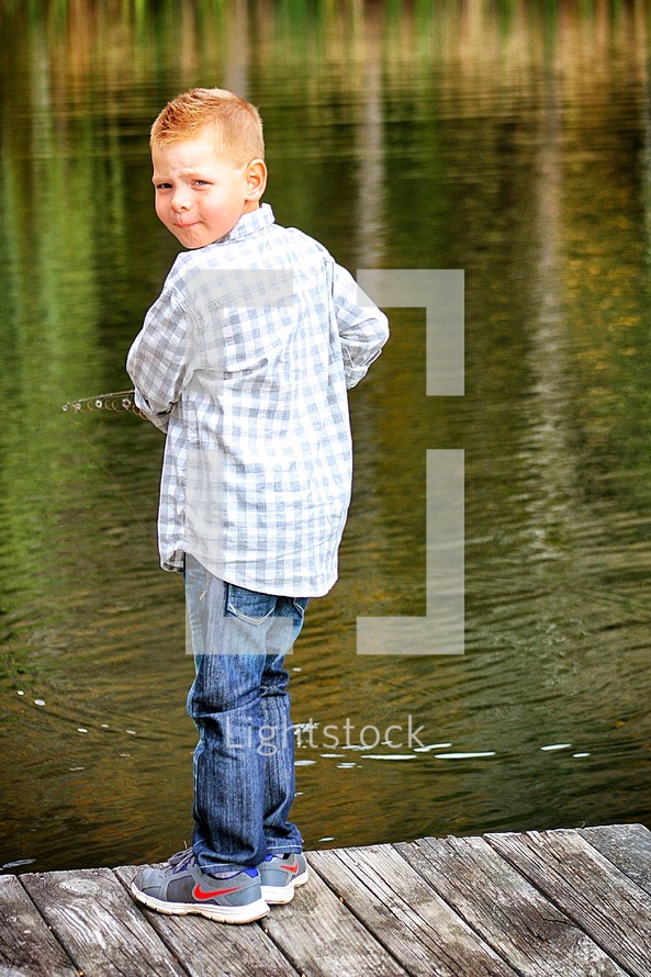 boy fishing on a dock