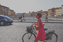 Pedestrians on a cobblestone street in Pisa, Italy 