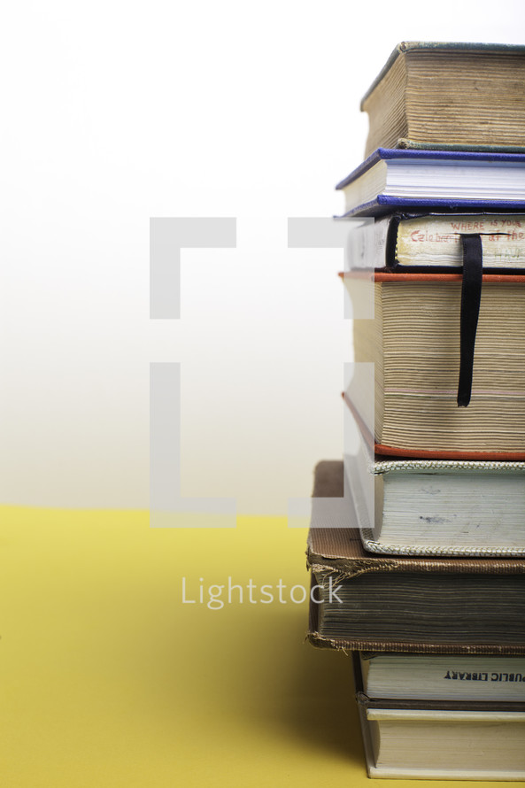 stack of books against a white background 
