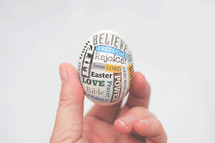 hand holding up an Easter egg 