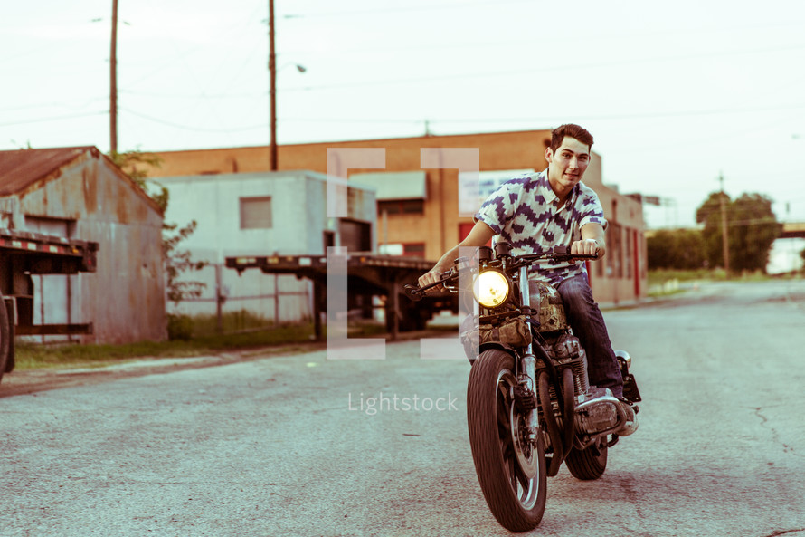 a man riding a motorcycle 