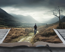A man walks on a surreal dark valley Bible landscape