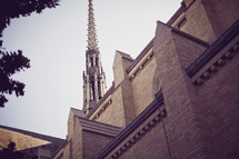 church steeple and side of building against sky - looking up
