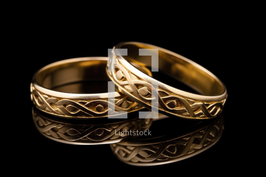 Sacrament: Matrimony. Wedding rings on a black background