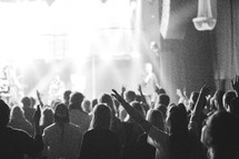 People worshipping Jesus with hands high during worship.
