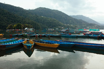 row boats on a lake 