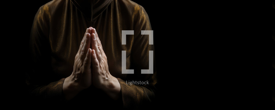 Close up of woman hands in prayer position isolated on black background with copy space