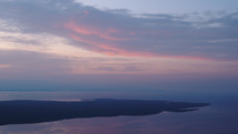 dawn twighlight over an island peninsula in the ocean