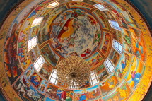 ceiling of a dome painted with scenes of heaven and God 