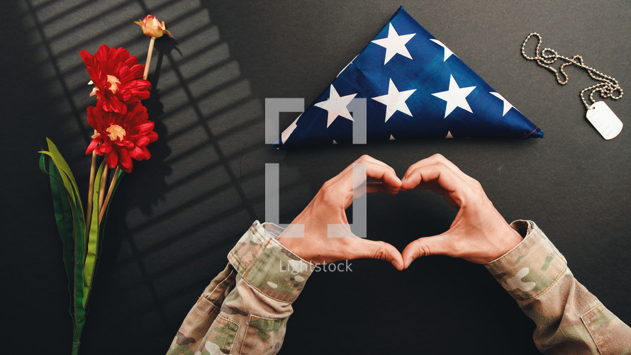 Heart symbol by a military for memorial day celebration