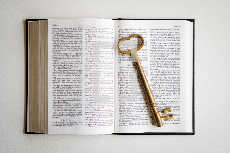 skeleton key on an open Bible 