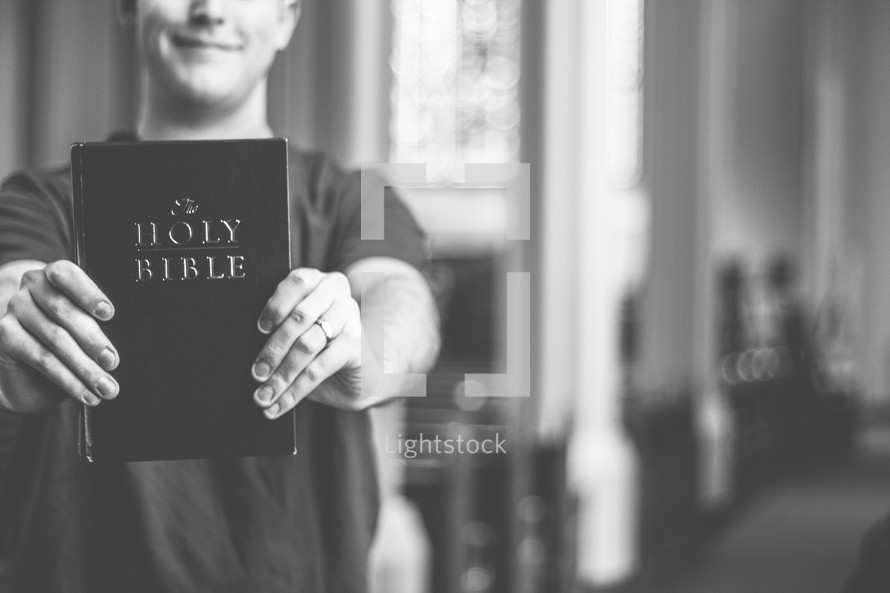 A man holding a Bible 