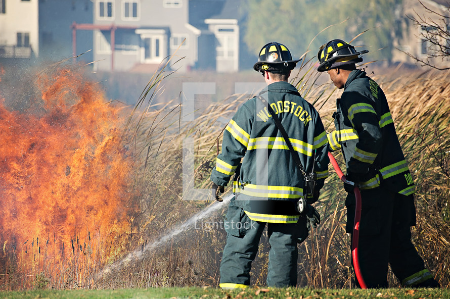 firefighters putting out brush fires 