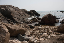 rocks along a beach shore 