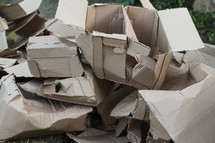 pile of ripped up cardboard boxes 