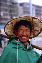 Chinese fisherman in a straw hat {Also try search for 'Ethnic Faces'} 