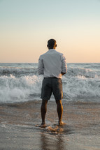 man standing on a beach 