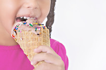 girl child eating an ice cream cone 