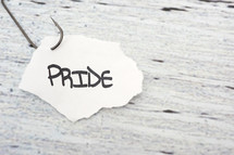 fish hook on paper with the word pride 