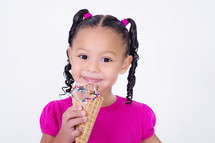 girl child holding an ice cream cone 