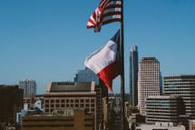 American flag and Texas flag on a flagpole 