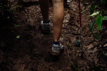 a woman hiking though the jungle 