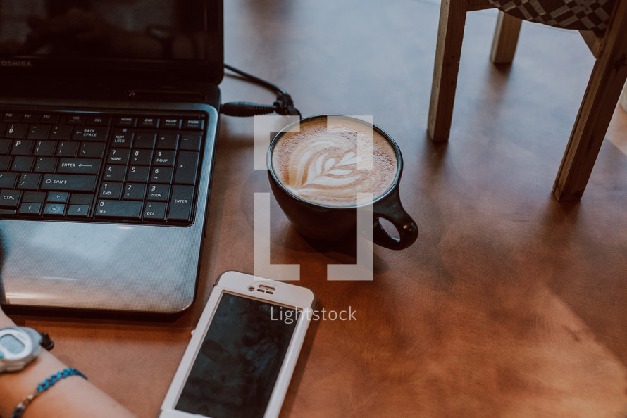 cappuccino, laptop, and cellphone 