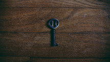 key on a wood floor 