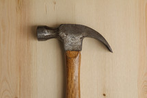 hammer on a wood background 