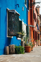colorful row houses along a cobblestone street 
