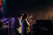 a band praying on stage 