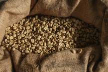 burlap sack of raw coffee beans