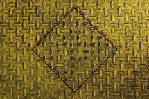 yellow metal grate with diamond cut out 