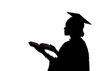 silhouette of a graduate holding a Bible 
