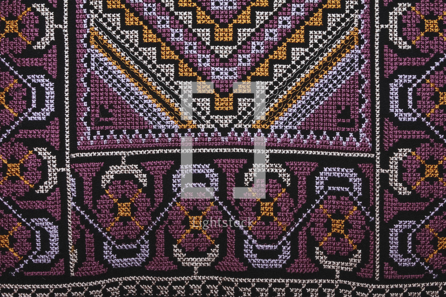 Close up of pattern on woman's robe from the Middle East