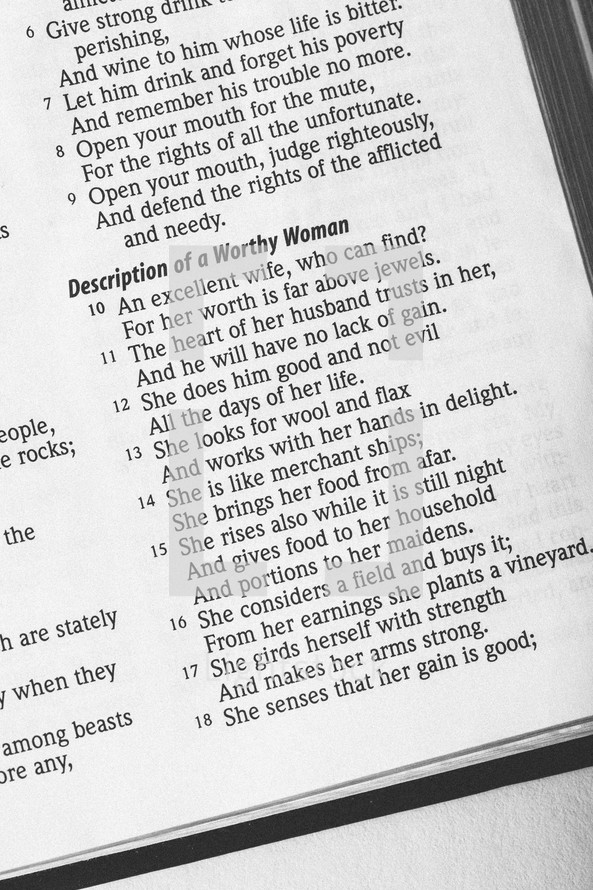 Bible open to Proverbs 31:10-18.