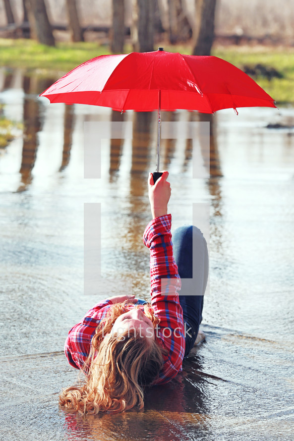 Teenage girl with umbrella
