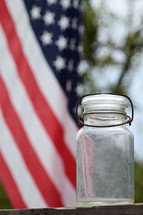 empty jar and American flag 