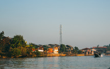 river with houses on Inle Lake in Myanmar