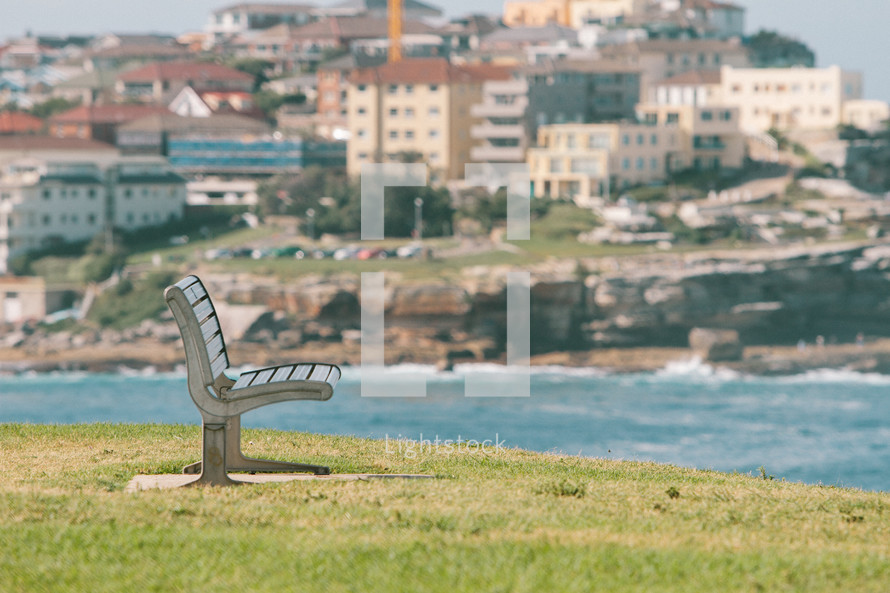 park bench by a shore 