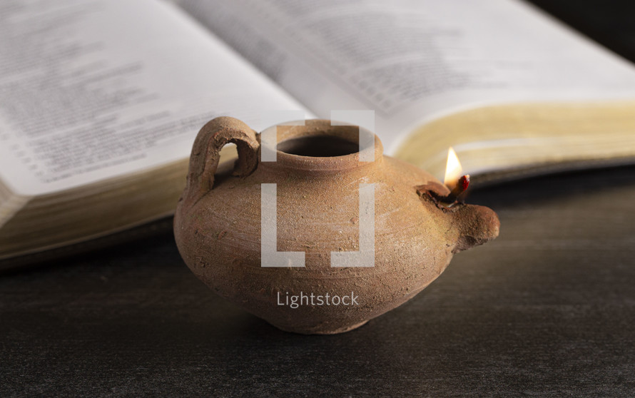 oil lamp and Bible 