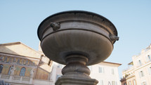 Details of a fountain in Trastevere square in Rome 