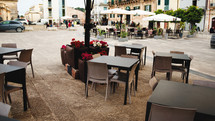 Tourist square with bar tables for breaks