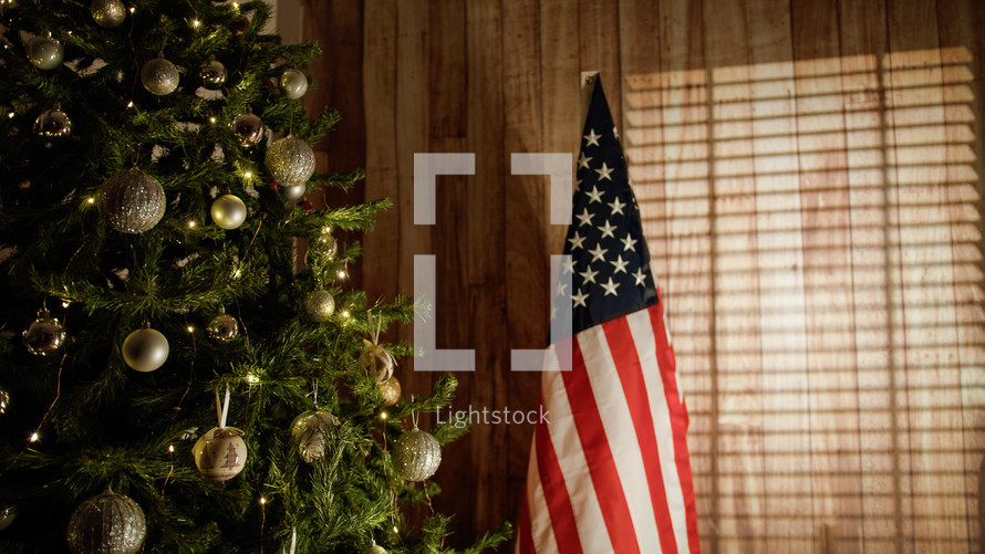 American flag near the Christmas tree in the house
