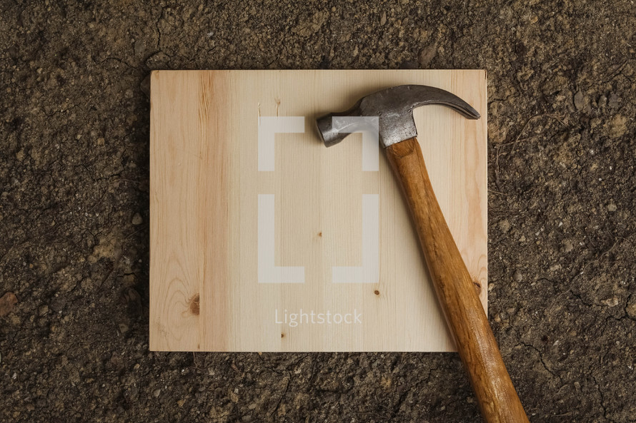 hammer on a wood board 